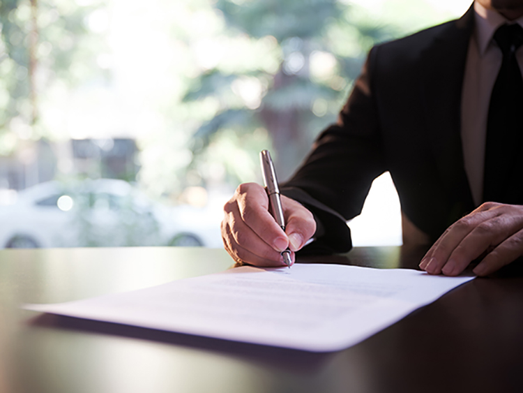 Lawyer signing papers