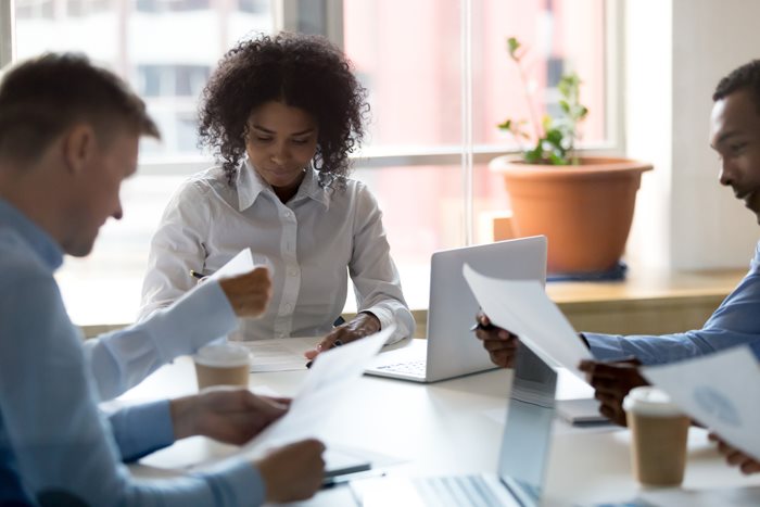 Legal professionals reviewing malpractice insurance policies for lawyers.